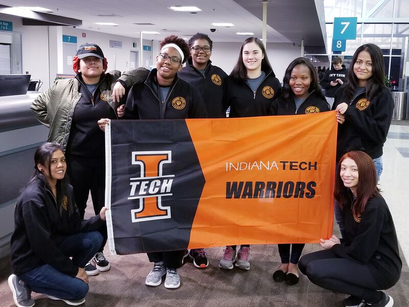 Spring break crew with the Indiana Tech flag.