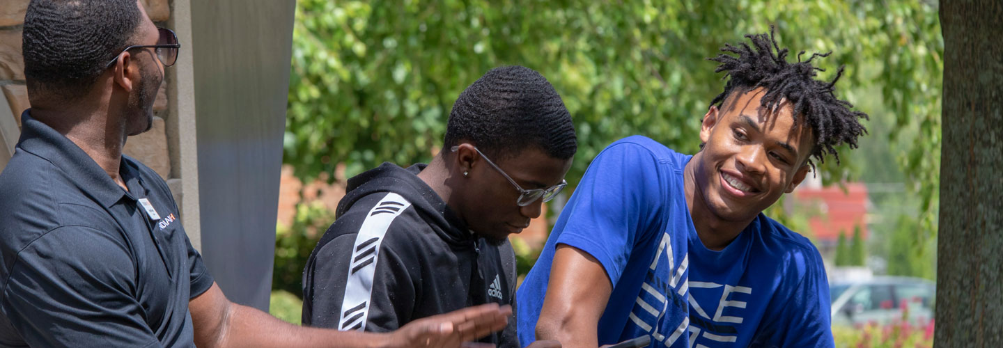 Summer bridge students talking outside